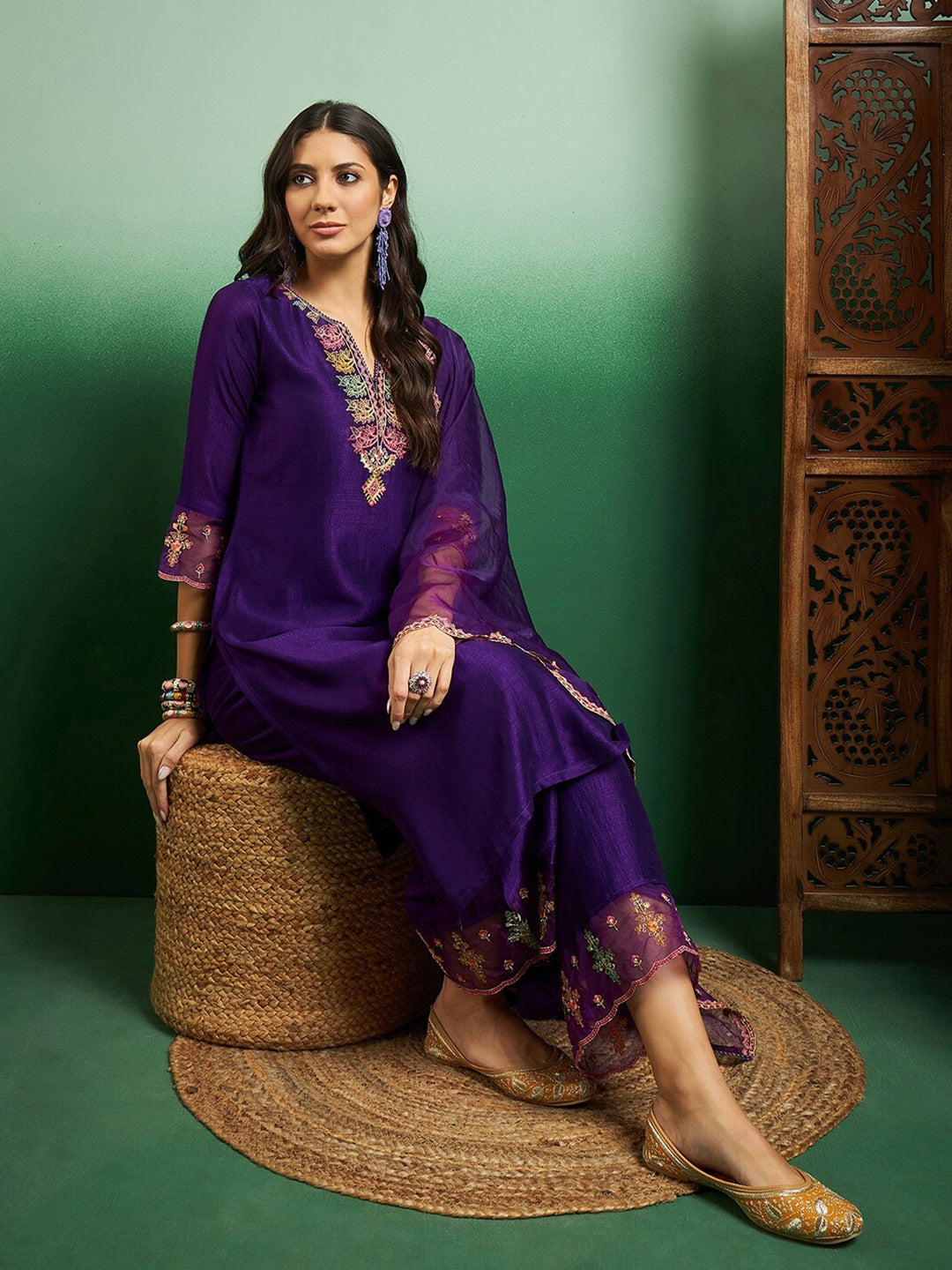 Elevate your style with this regal purple kurti set, adorned with intricate embroidery and delicate scalloped detailing