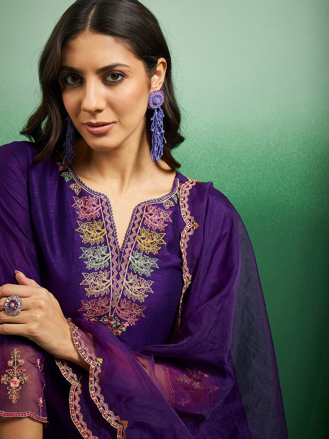 Elevate your style with this regal purple kurti set, adorned with intricate embroidery and delicate scalloped detailing