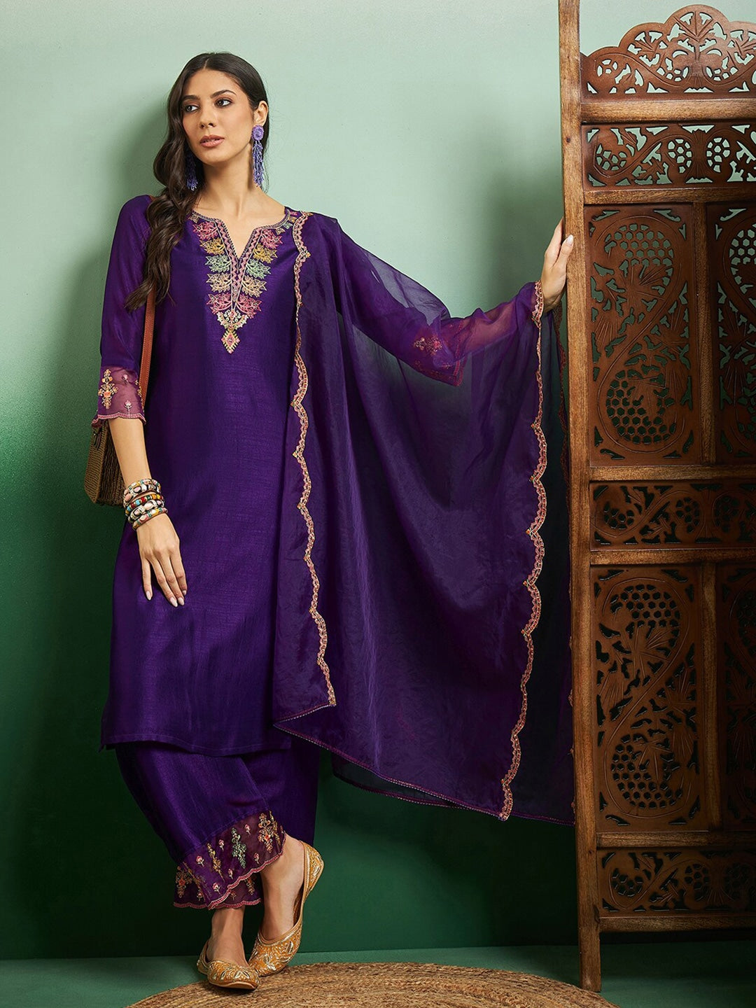 Elevate your style with this regal purple kurti set, adorned with intricate embroidery and delicate scalloped detailing