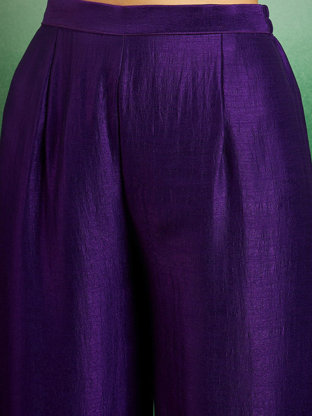 Elevate your style with this regal purple kurti set, adorned with intricate embroidery and delicate scalloped detailing