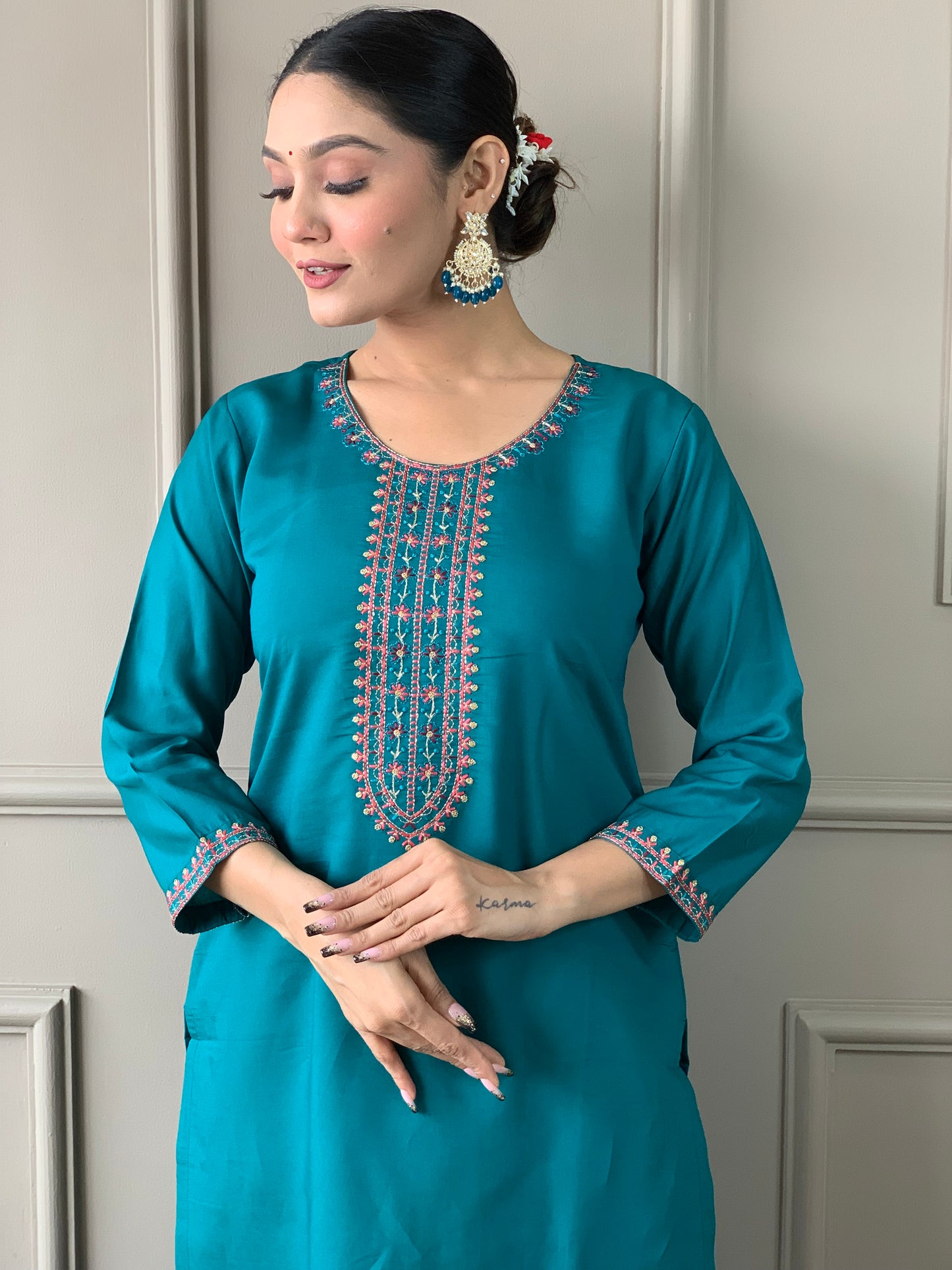 Brighten up your wardrobe with this elegant yellow kurti set, featuring delicate embroidery and a floral-printed dupatta