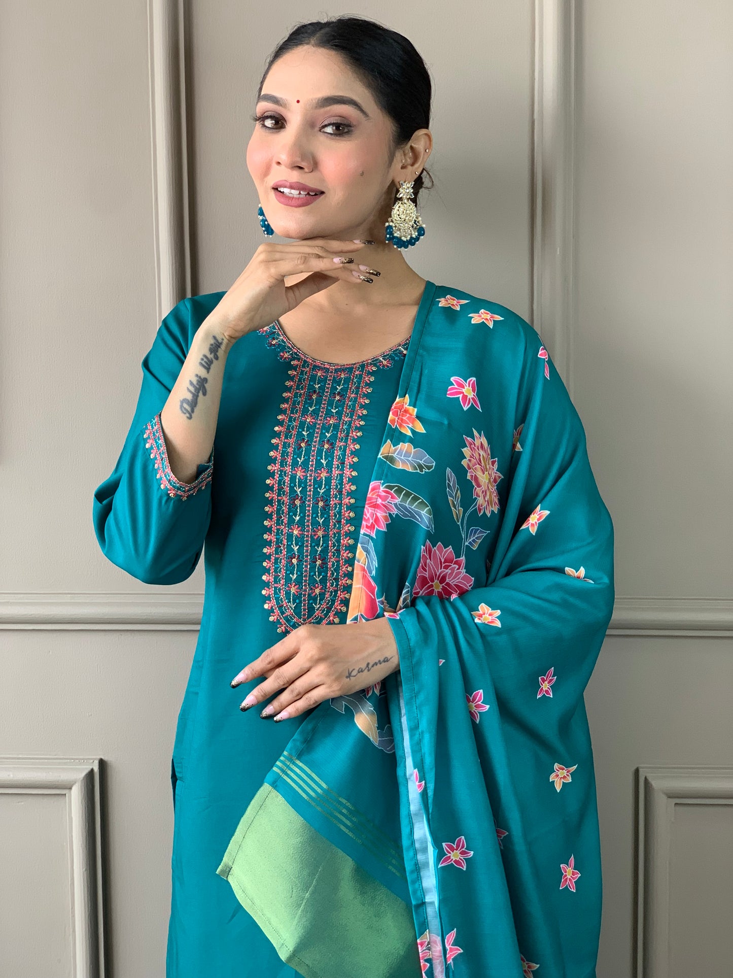 Brighten up your wardrobe with this elegant yellow kurti set, featuring delicate embroidery and a floral-printed dupatta