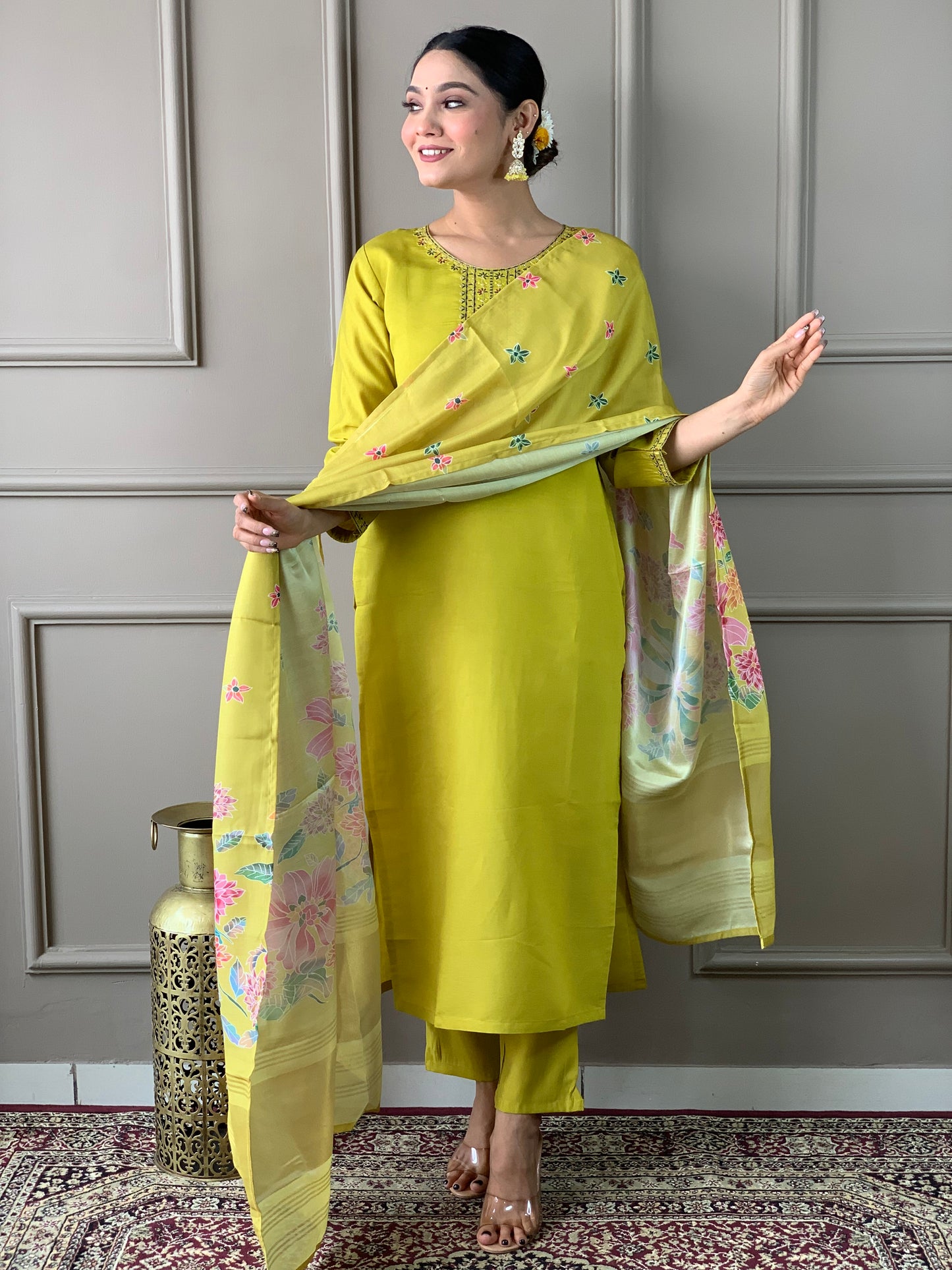 Brighten up your wardrobe with this elegant yellow kurti set, featuring delicate embroidery and a floral-printed dupatta