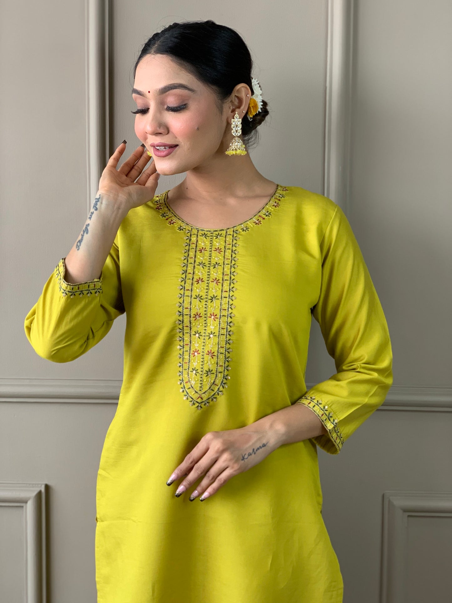 Brighten up your wardrobe with this elegant yellow kurti set, featuring delicate embroidery and a floral-printed dupatta