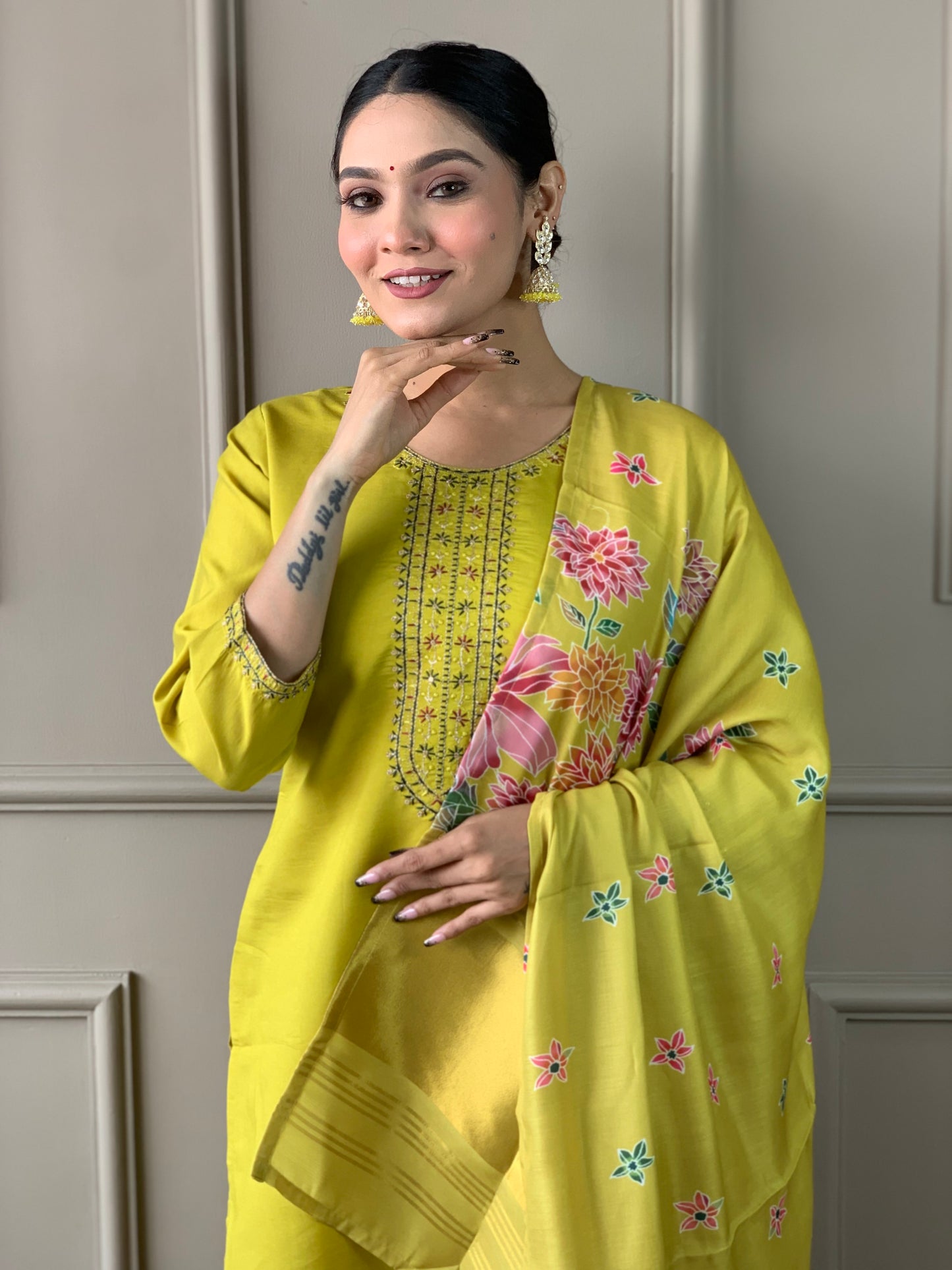 Brighten up your wardrobe with this elegant yellow kurti set, featuring delicate embroidery and a floral-printed dupatta
