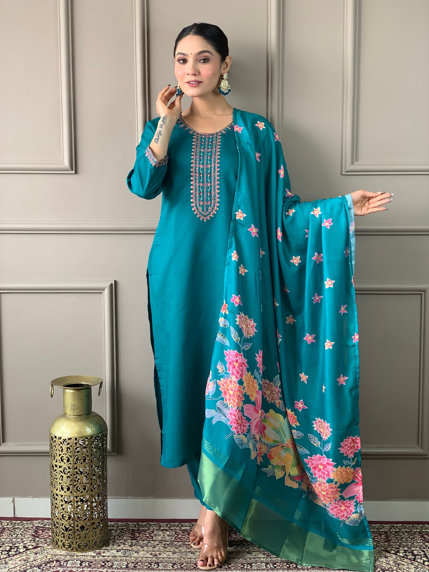 Brighten up your wardrobe with this elegant yellow kurti set, featuring delicate embroidery and a floral-printed dupatta