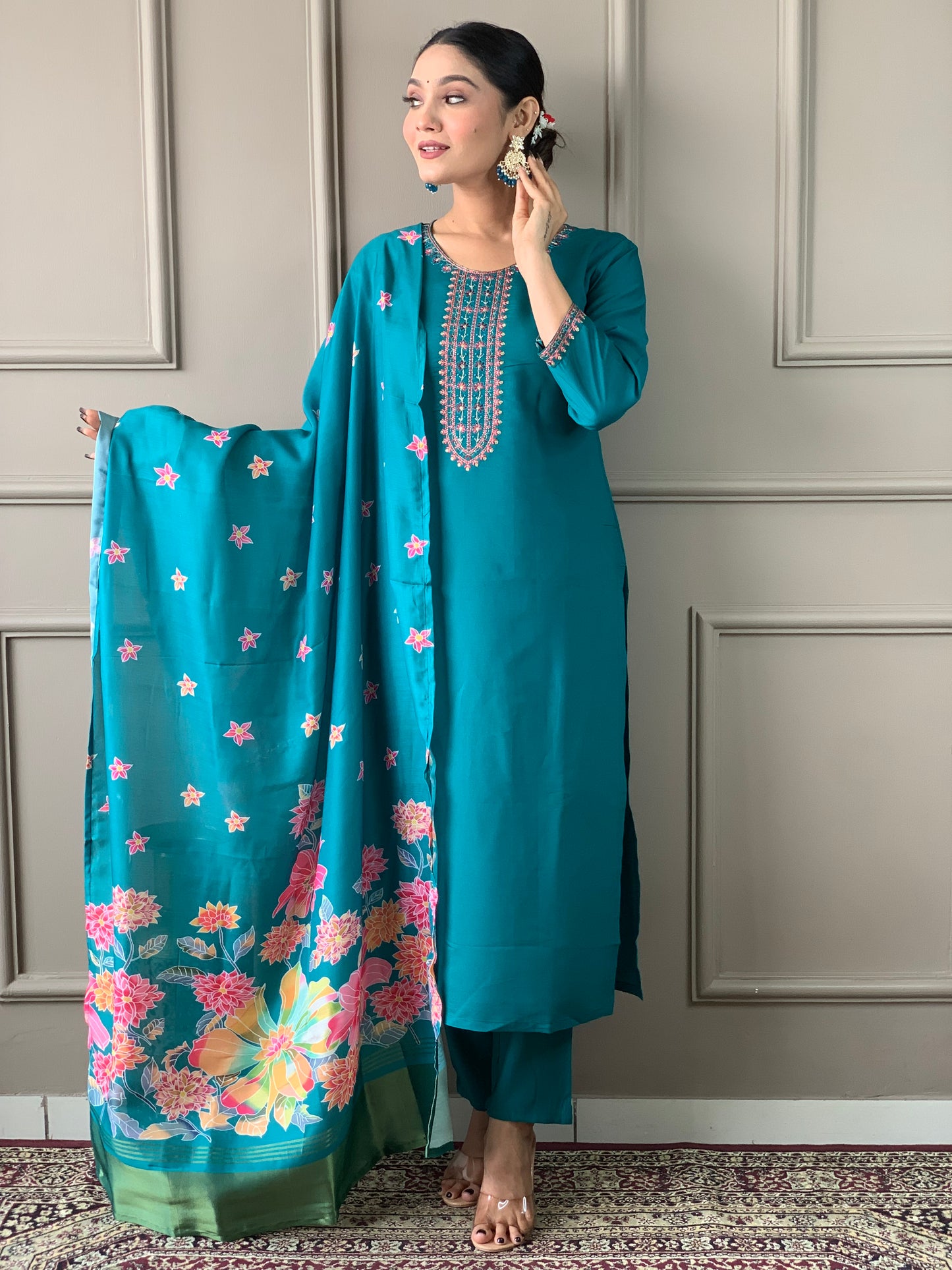 Brighten up your wardrobe with this elegant yellow kurti set, featuring delicate embroidery and a floral-printed dupatta