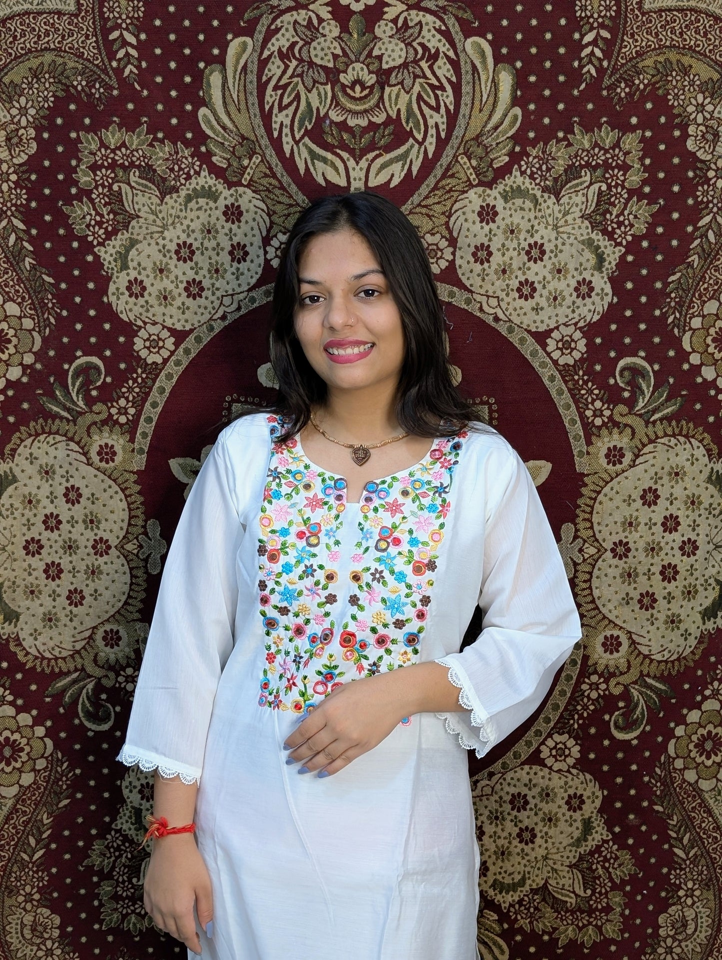 Elevate your elegance with this pristine white kurti set, featuring exquisite multicolor embroidery on the neckline