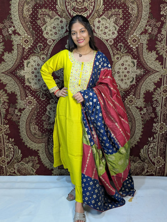 Brighten your wardrobe with this vibrant yellow kurti set, featuring delicate mirror work on the neckline and a stunning multicolor Bandhani dupatta. A perfect blend of tradition and bold style, it's ideal for festive events or casual elegance