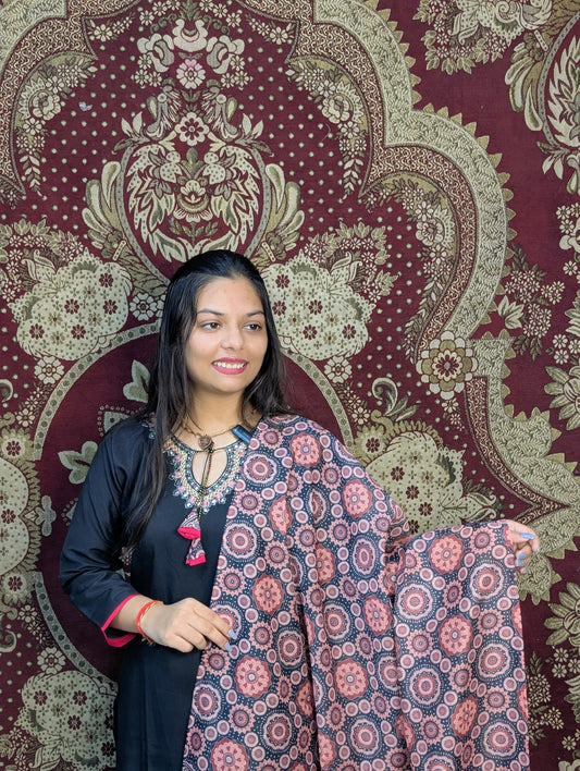 Exude elegance in this black kurti set, highlighted by intricate embroidery around the neckline and a beautifully printed dupatta in earthy tones. A perfect pick for graceful gatherings, this ensemble brings together simplicity and sophistication.