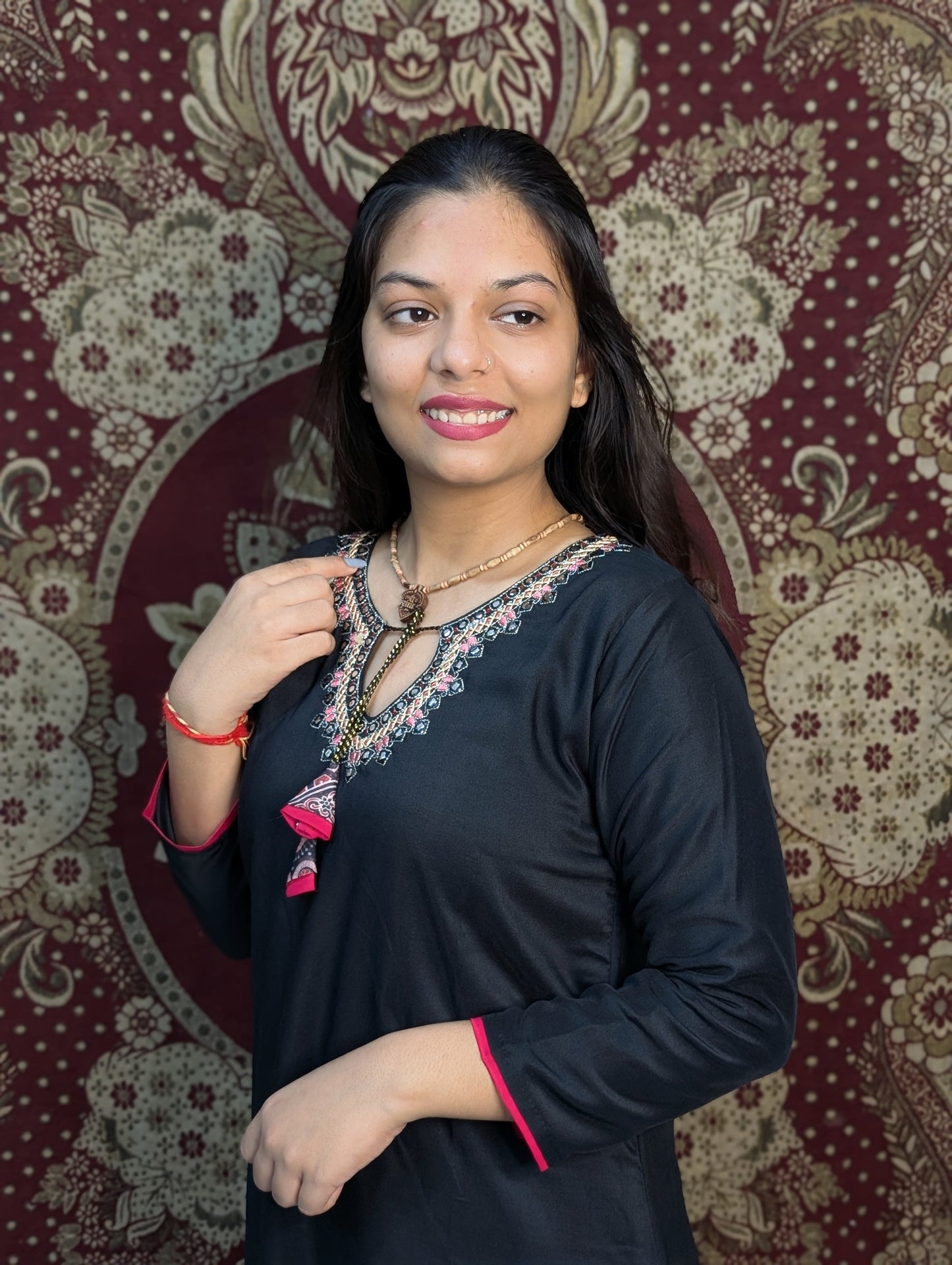 Exude elegance in this black kurti set, highlighted by intricate embroidery around the neckline and a beautifully printed dupatta in earthy tones. A perfect pick for graceful gatherings, this ensemble brings together simplicity and sophistication.