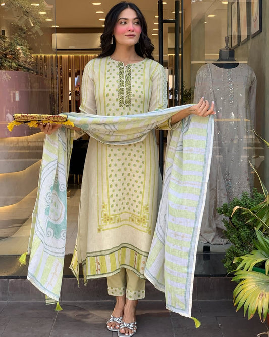 Brighten your wardrobe with this charming pastel green kurti set featuring playful polka dot prints and fine embroidery. Paired with a striped dupatta and matching pants, it's perfect for a light, breezy, and elegant daytime look.