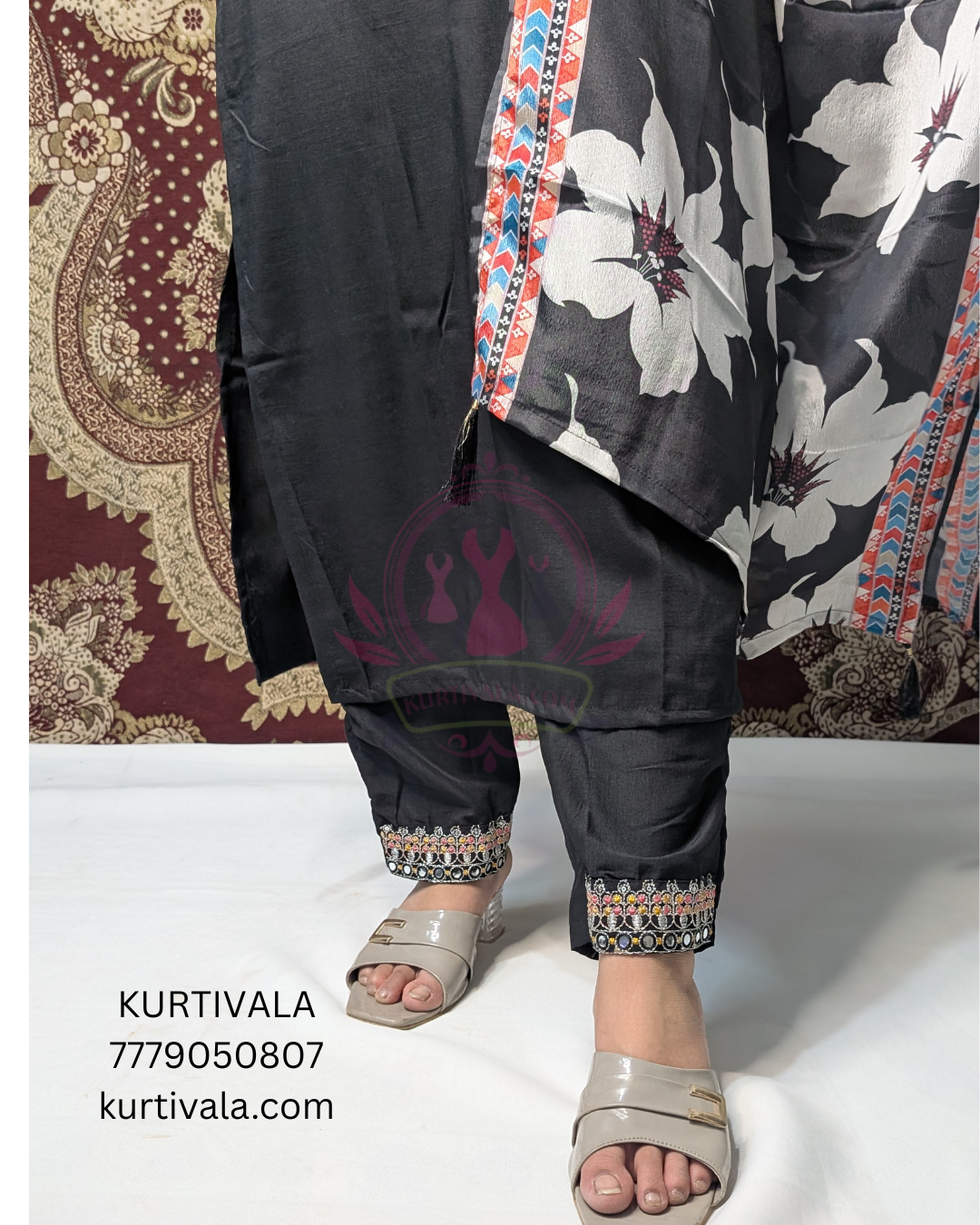 Elegant black kurti set adorned with intricate embroidery and a stylish printed dupatta. Perfect for festive occasions and casual gatherings, offering a blend of traditional charm and modern sophistication