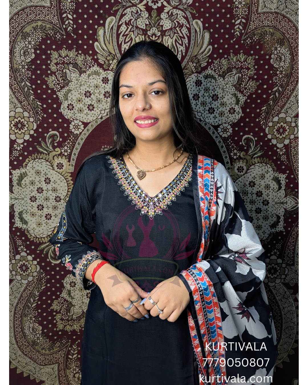 Elegant black kurti set adorned with intricate embroidery and a stylish printed dupatta. Perfect for festive occasions and casual gatherings, offering a blend of traditional charm and modern sophistication