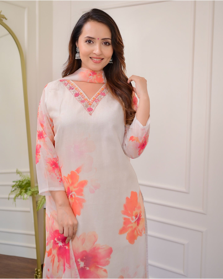 Embrace elegance with this gorgeous pink kurti set, featuring delicate embroidery and floral prints.
