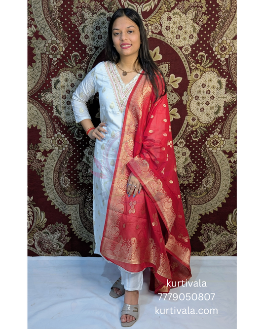 Radiate elegance in this white kurti set paired with a rich red Banarasi dupatta. Featuring delicate embroidery on the neckline and golden motifs on the dupatta, it's perfect for traditional functions, festive events, and graceful everyday wear