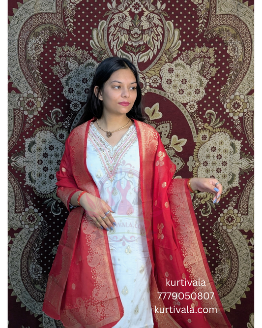 Radiate elegance in this white kurti set paired with a rich red Banarasi dupatta. Featuring delicate embroidery on the neckline and golden motifs on the dupatta, it's perfect for traditional functions, festive events, and graceful everyday wear