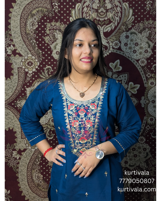 Make a bold style statement with this deep blue kurti set adorned with elegant thread embroidery and subtle embellishments. Paired with a rich multicolor woven dupatta, it’s a perfect blend of tradition and contemporary flair for festive occasions.