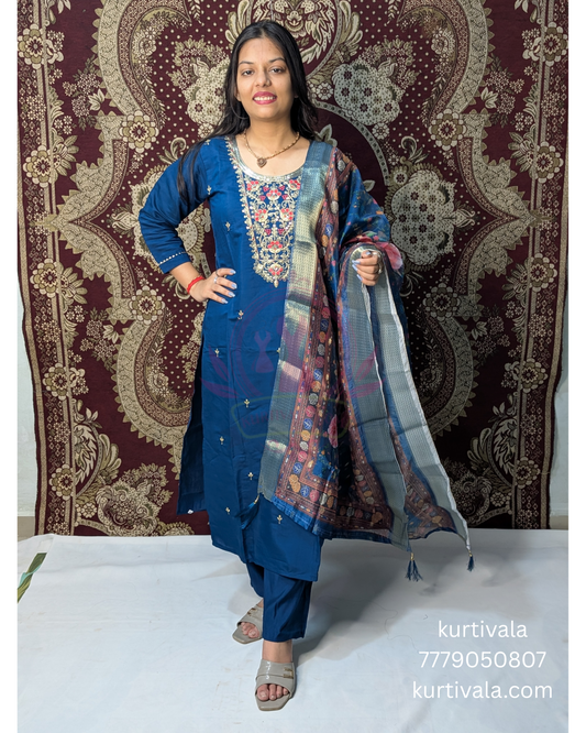 Make a bold style statement with this deep blue kurti set adorned with elegant thread embroidery and subtle embellishments. Paired with a rich multicolor woven dupatta, it’s a perfect blend of tradition and contemporary flair for festive occasions.