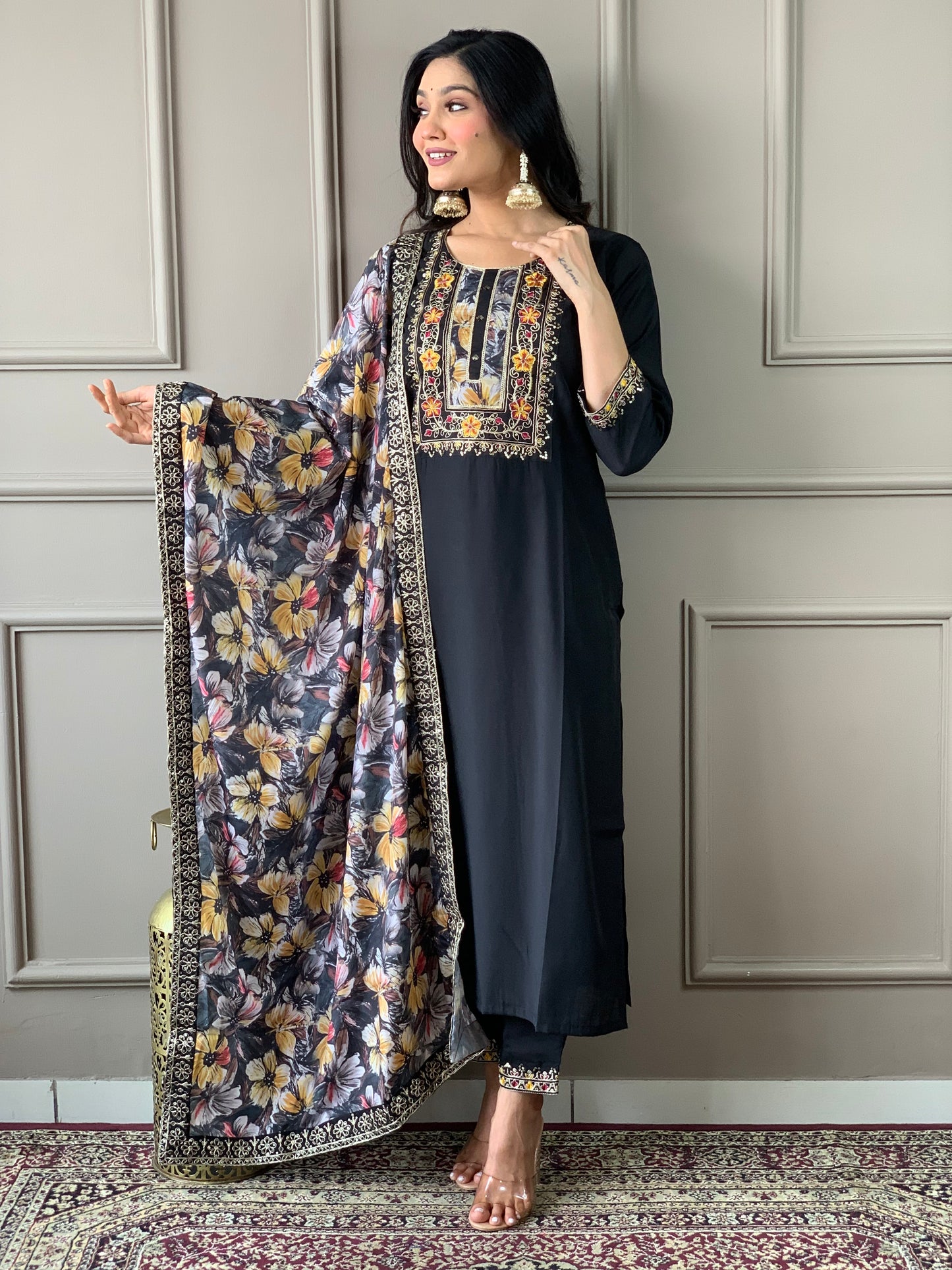 Discover elegance with our beautifully designed black embroidered outfit, featuring intricate floral patterns and a matching dupatta.
