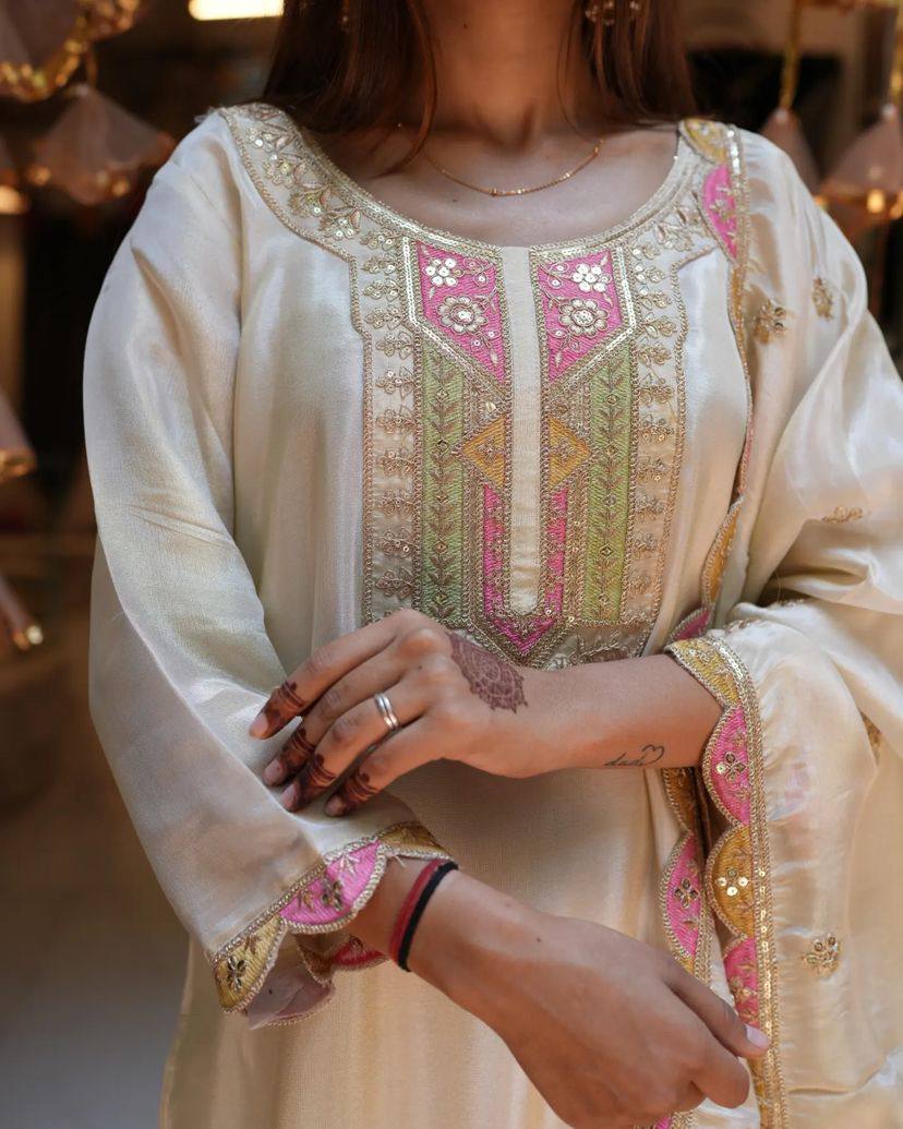 Elevate your elegance with this stunning off-white embroidered Kurti set. Adorned with delicate pink and gold accents, it features intricate detailing, a graceful dupatta