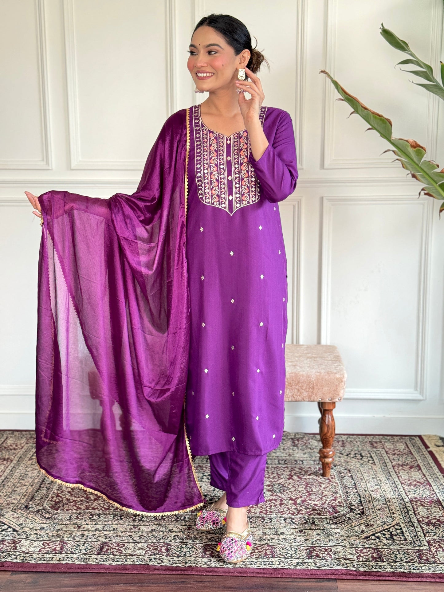 Elevate your style with this elegant purple Kurti set, featuring intricate embroidery and delicate embellishments