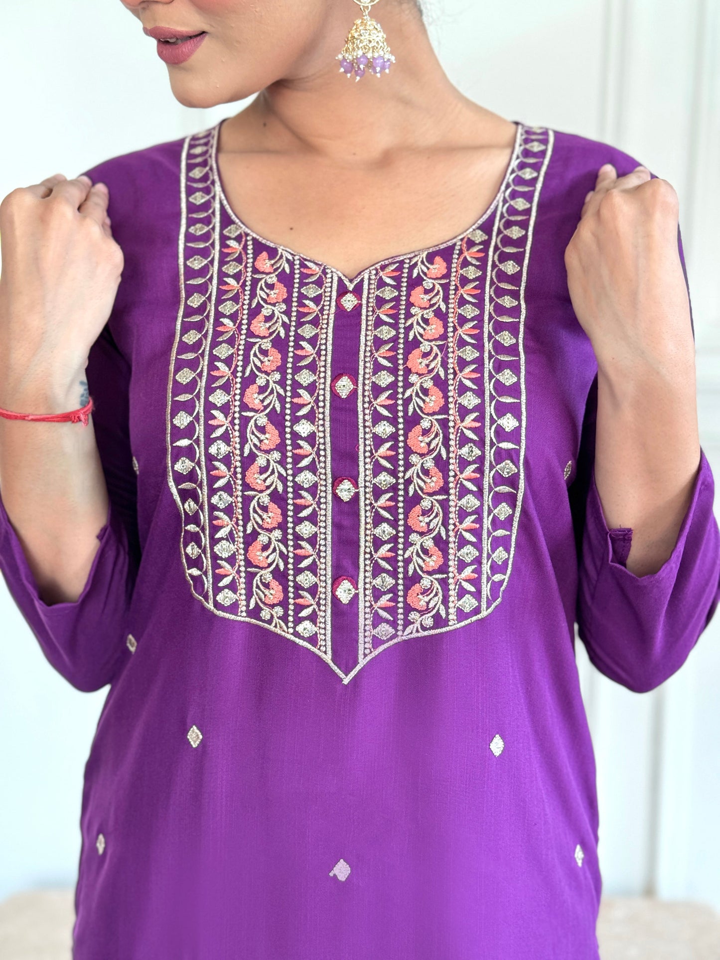 Elevate your style with this elegant purple Kurti set, featuring intricate embroidery and delicate embellishments