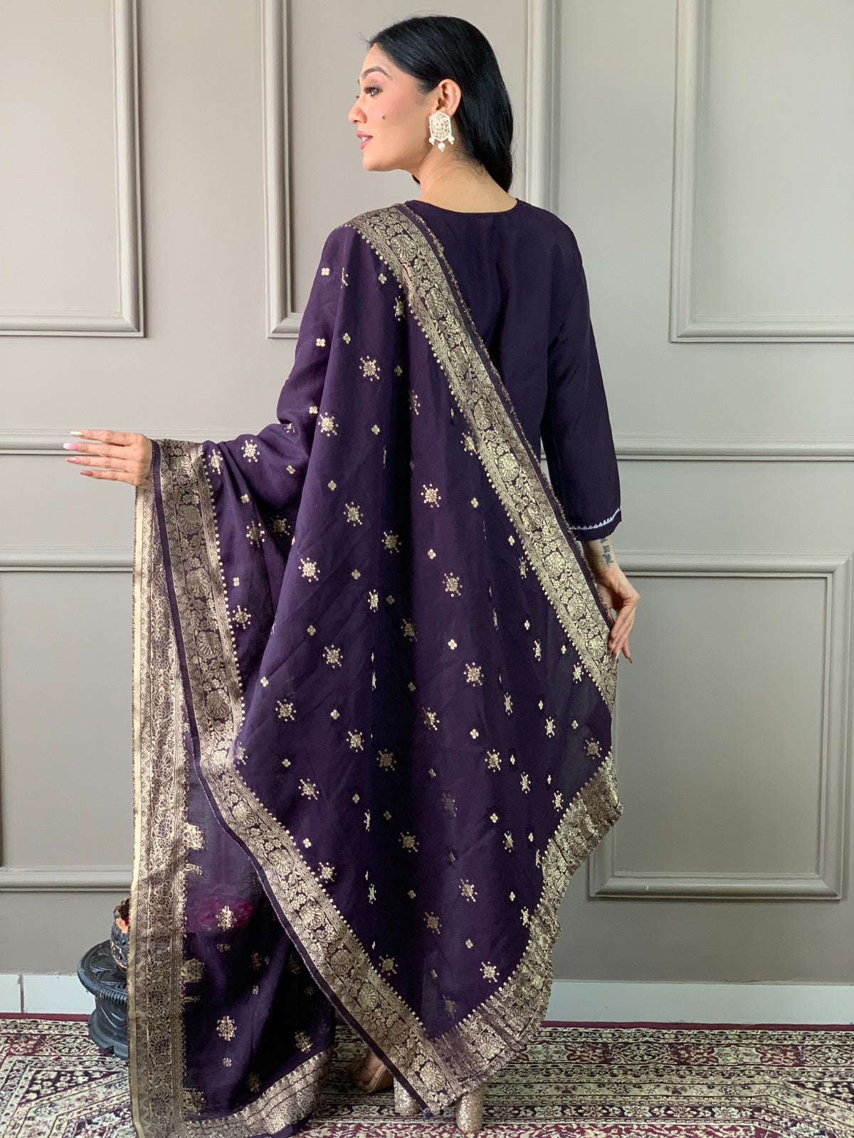 Exude elegance in this deep plum kurti set, featuring exquisite embroidery and a rich gold-detailed dupatta
