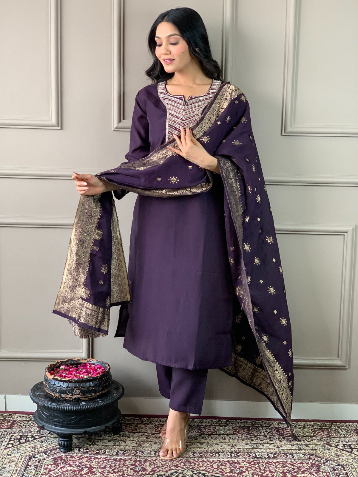 Exude elegance in this deep plum kurti set, featuring exquisite embroidery and a rich gold-detailed dupatta