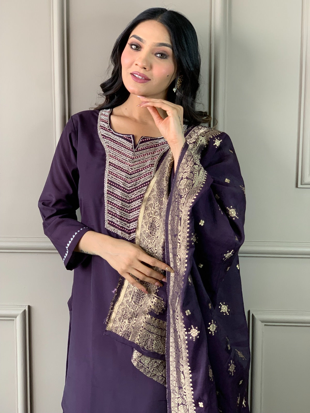 Exude elegance in this deep plum kurti set, featuring exquisite embroidery and a rich gold-detailed dupatta