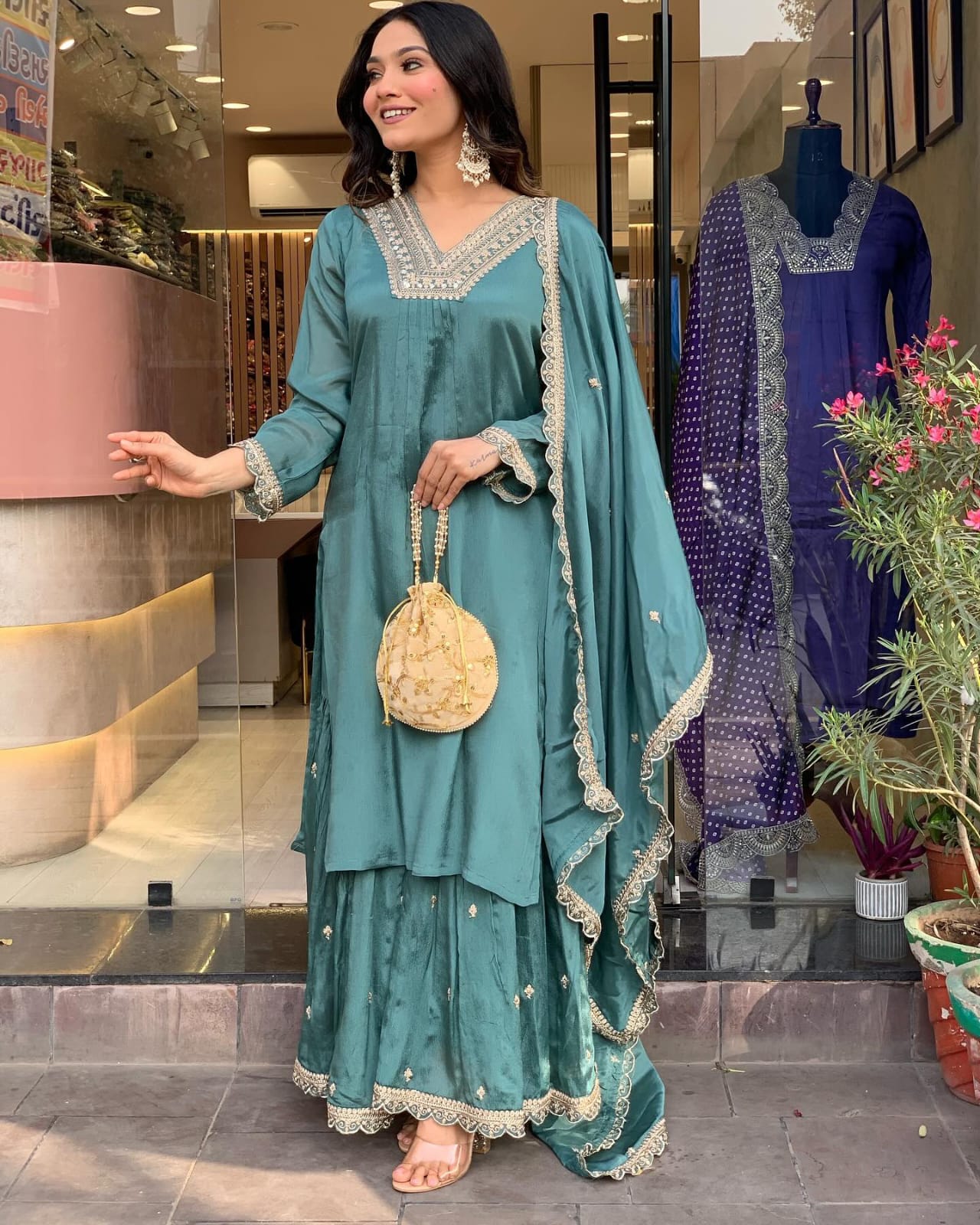 Elevate your style with this elegant teal kurti set, featuring intricate embroidery, delicate lacework, and a flowy silhouette