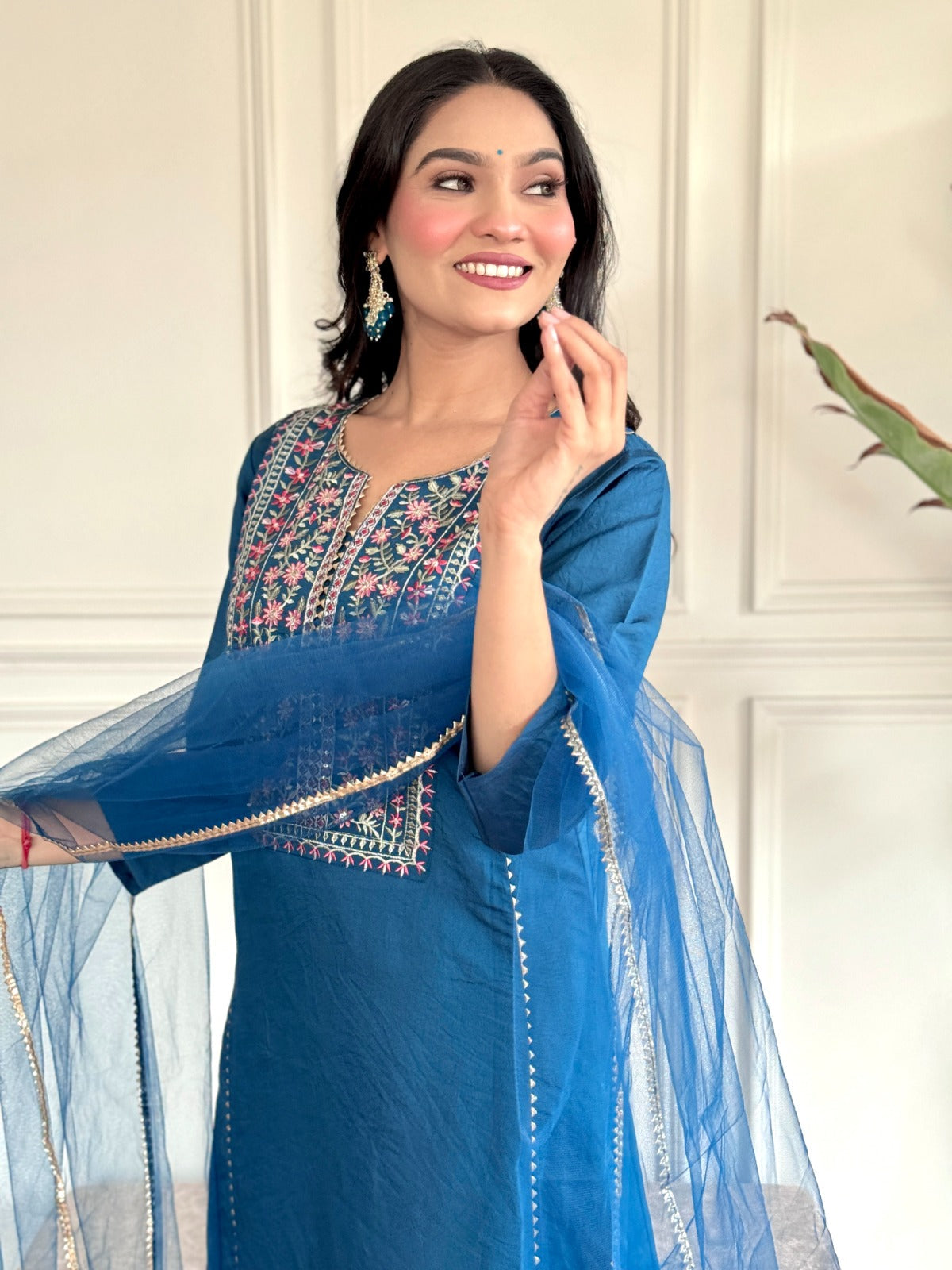 "Make a statement in this gorgeous teal blue kurti set, adorned with intricate embroidery and delicate detailing