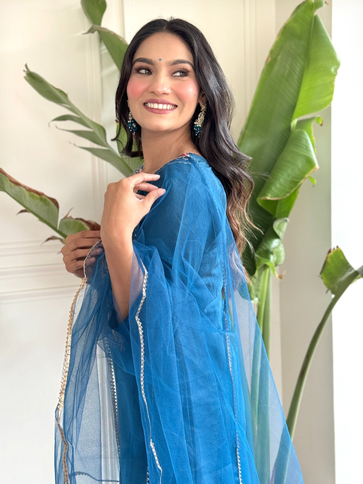 "Make a statement in this gorgeous teal blue kurti set, adorned with intricate embroidery and delicate detailing