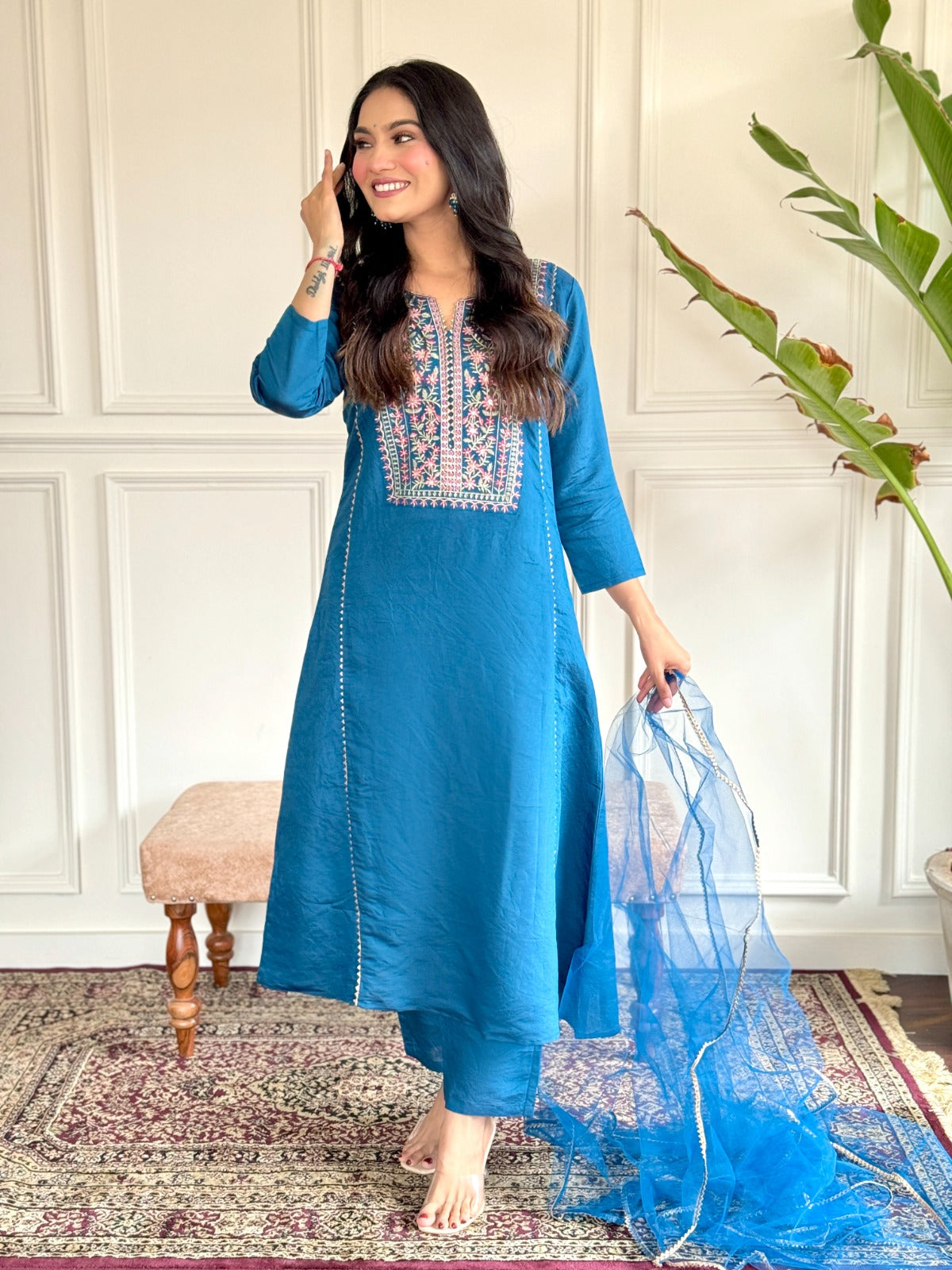 "Make a statement in this gorgeous teal blue kurti set, adorned with intricate embroidery and delicate detailing