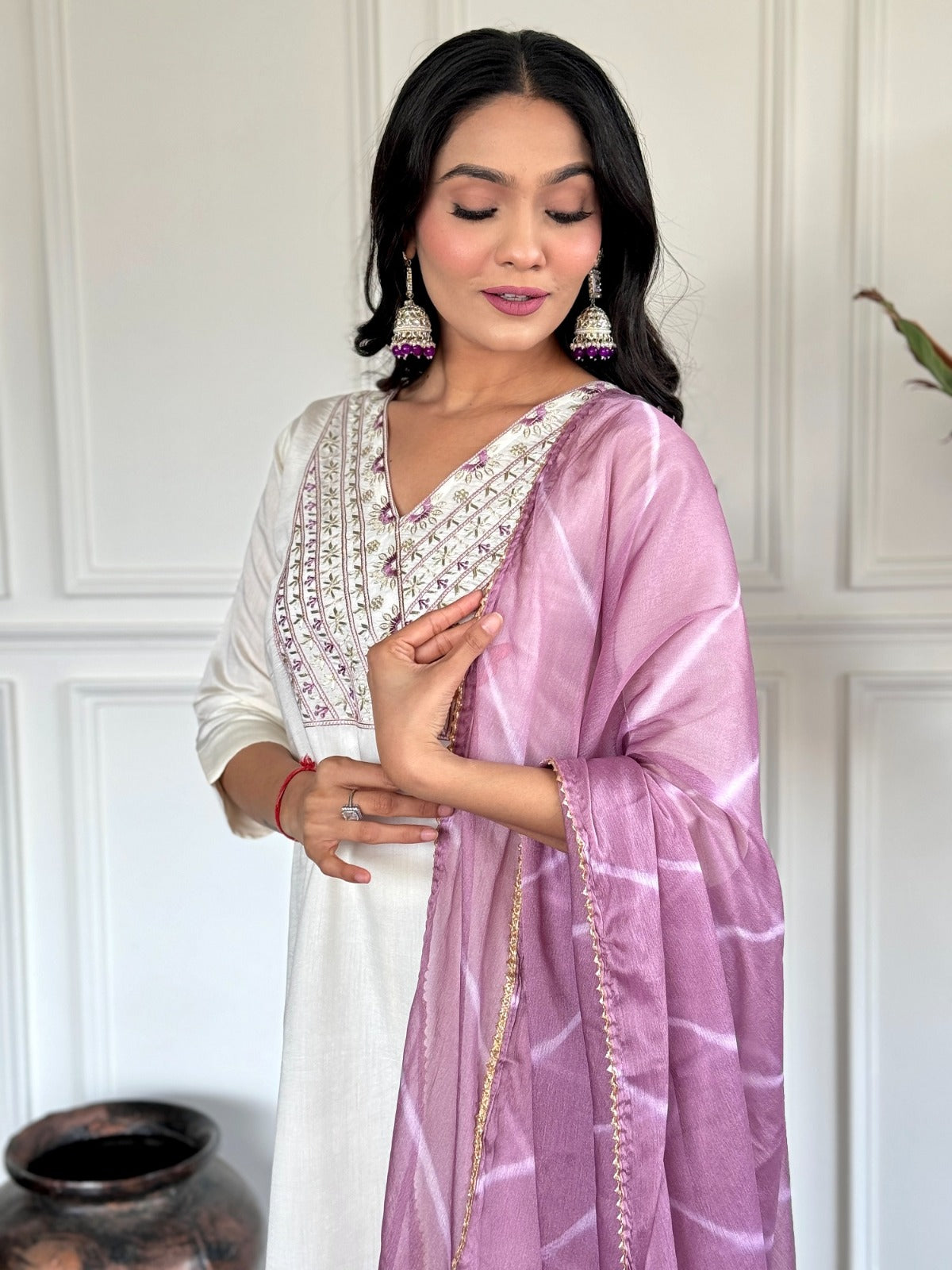 mbrace timeless elegance with this ivory kurti set, featuring delicate embroidery and a soft tie-dye dupatta in pastel hues