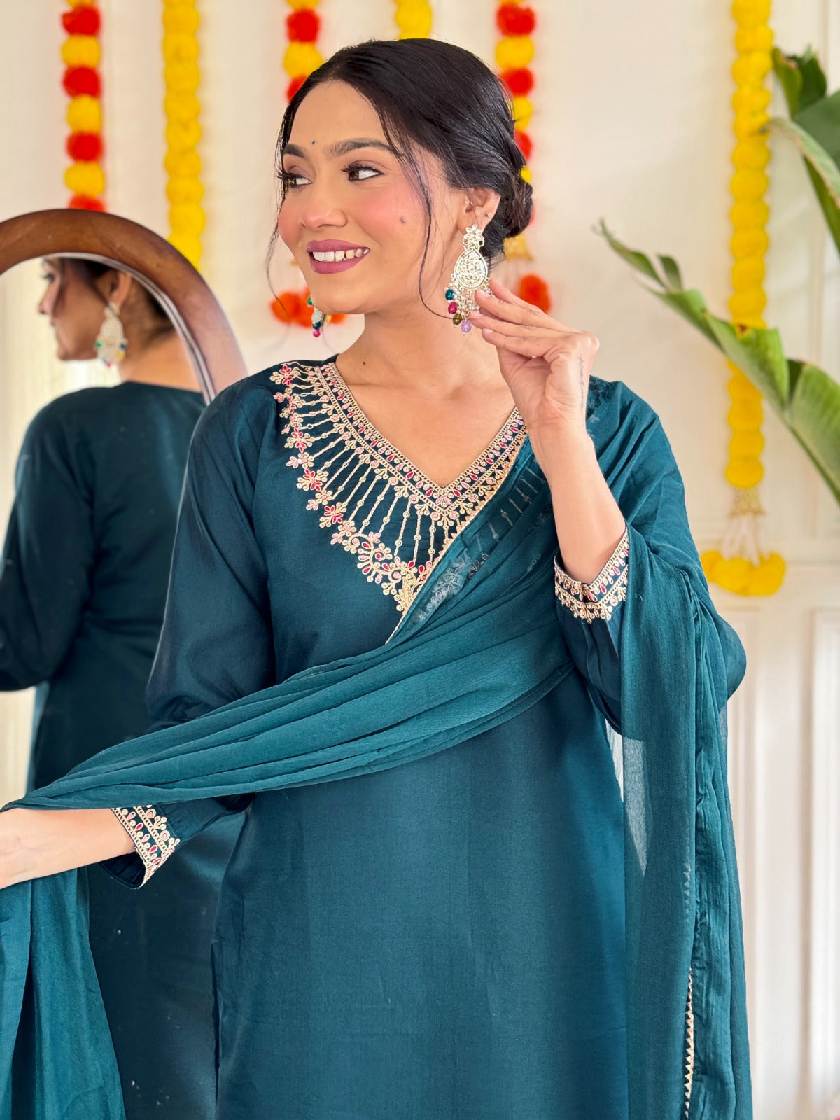 Step into elegance with this stunning deep teal kurti set, adorned with exquisite embroidery and a graceful sheer dupatta