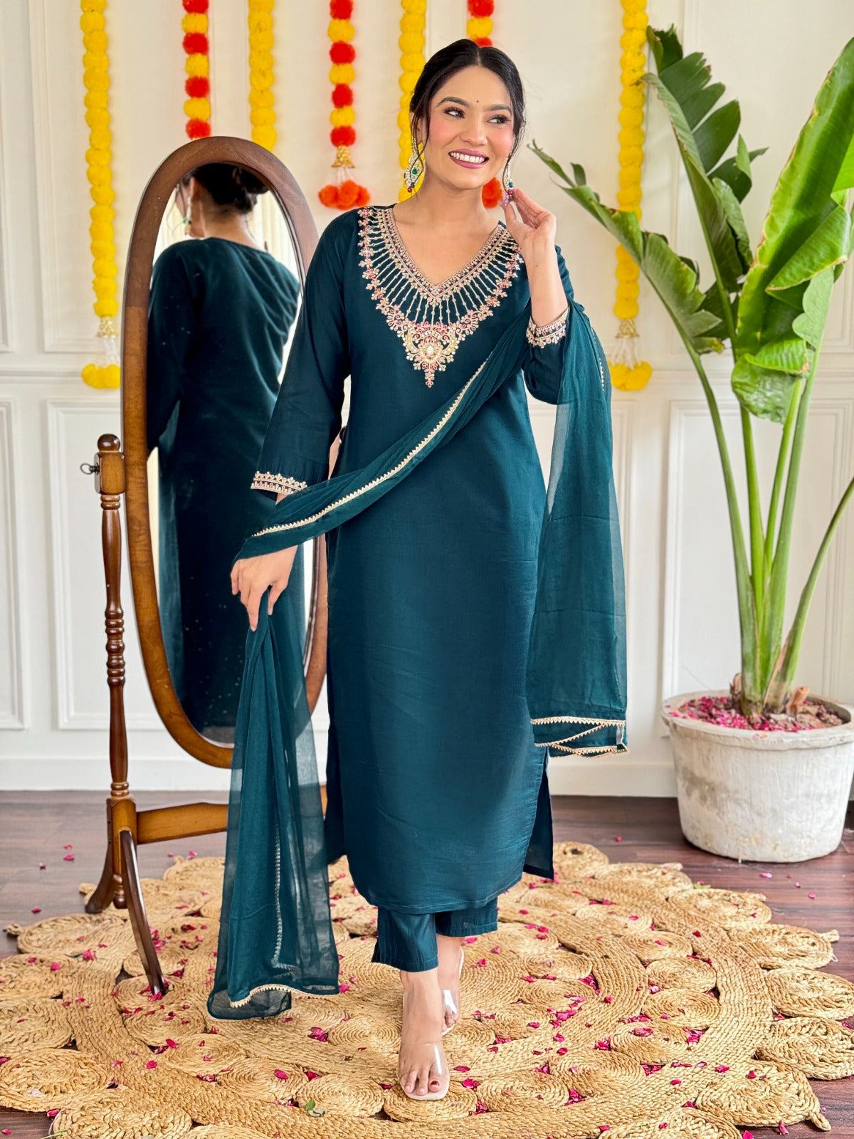 Step into elegance with this stunning deep teal kurti set, adorned with exquisite embroidery and a graceful sheer dupatta