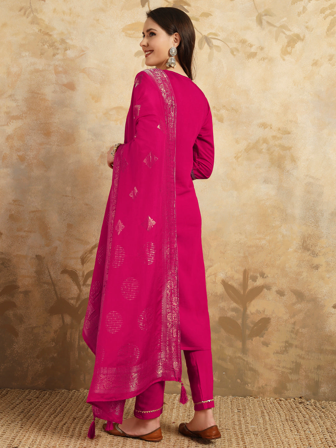 Radiate grace in this stunning magenta kurti set, adorned with intricate embroidery and delicate golden accents