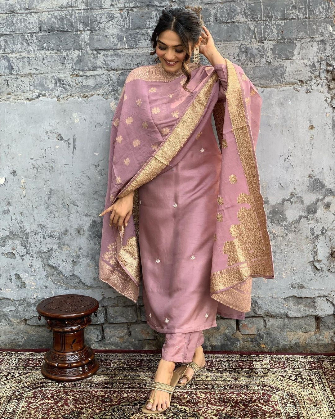 Indulge in sophistication with this subtle mauve kurta set, intricately adorned with gold-toned embroidery