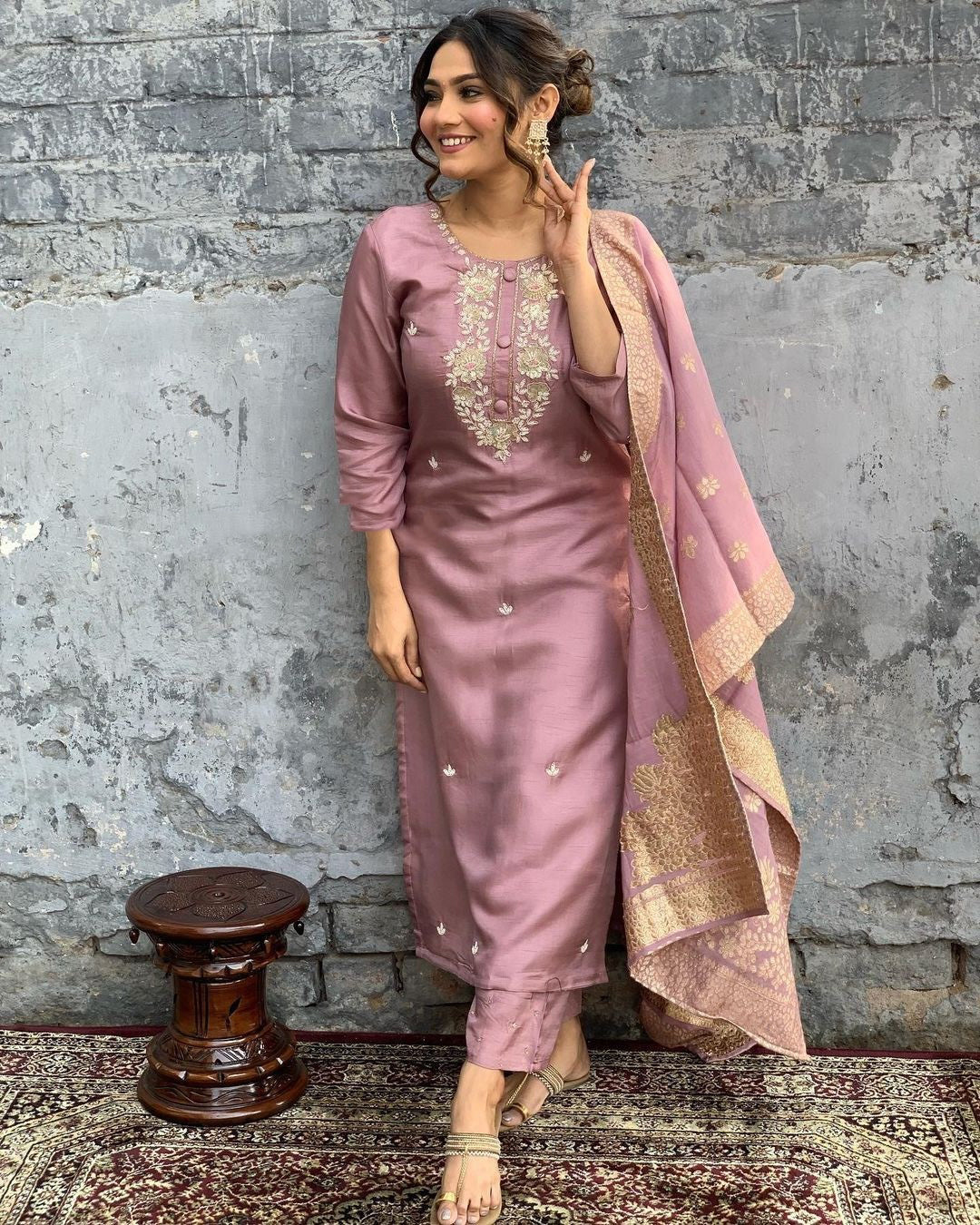 Indulge in sophistication with this subtle mauve kurta set, intricately adorned with gold-toned embroidery