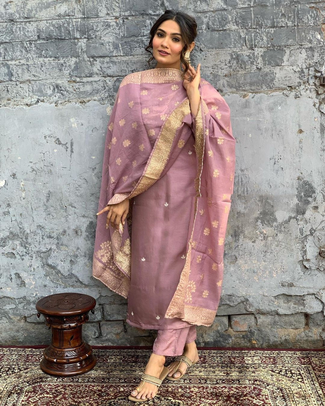 Indulge in sophistication with this subtle mauve kurta set, intricately adorned with gold-toned embroidery