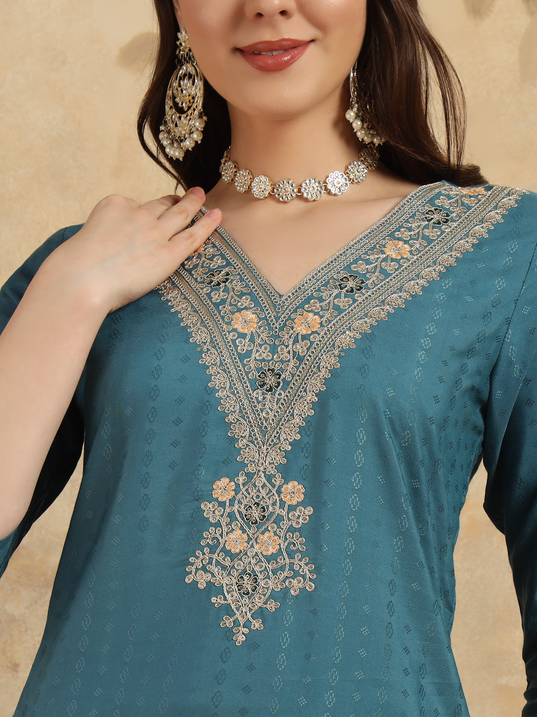 Infuse your wardrobe with elegance in this teal kurta set, showcasing delicate embroidery and a romantic floral dupatta