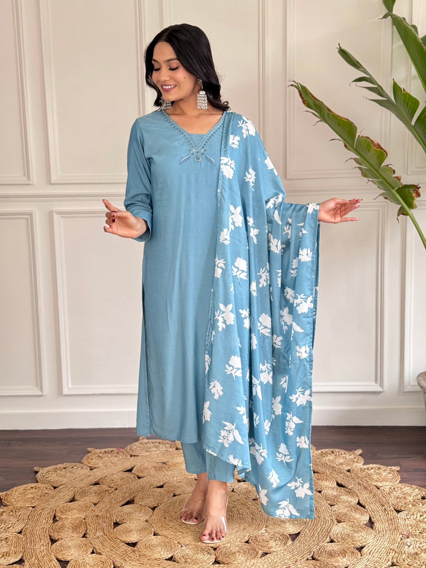Exude elegance in this serene blue kurta set, adorned with delicate embroidery and a charming floral-print dupatta