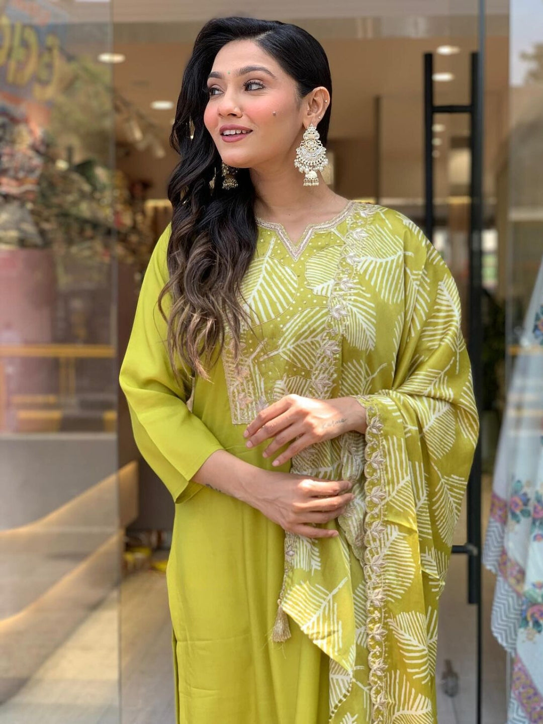 Embrace elegance with this refreshing green kurta set, featuring intricate embroidery and a graceful leaf-patterned dupatta