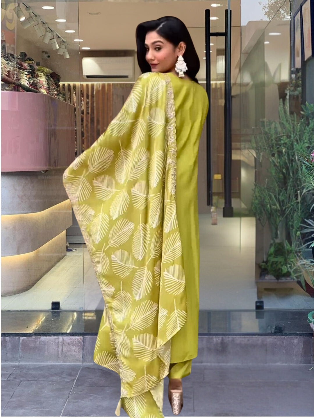 Embrace elegance with this refreshing green kurta set, featuring intricate embroidery and a graceful leaf-patterned dupatta