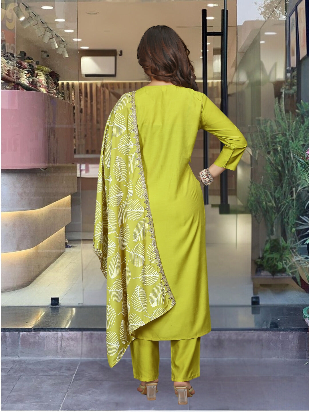 Embrace elegance with this refreshing green kurta set, featuring intricate embroidery and a graceful leaf-patterned dupatta