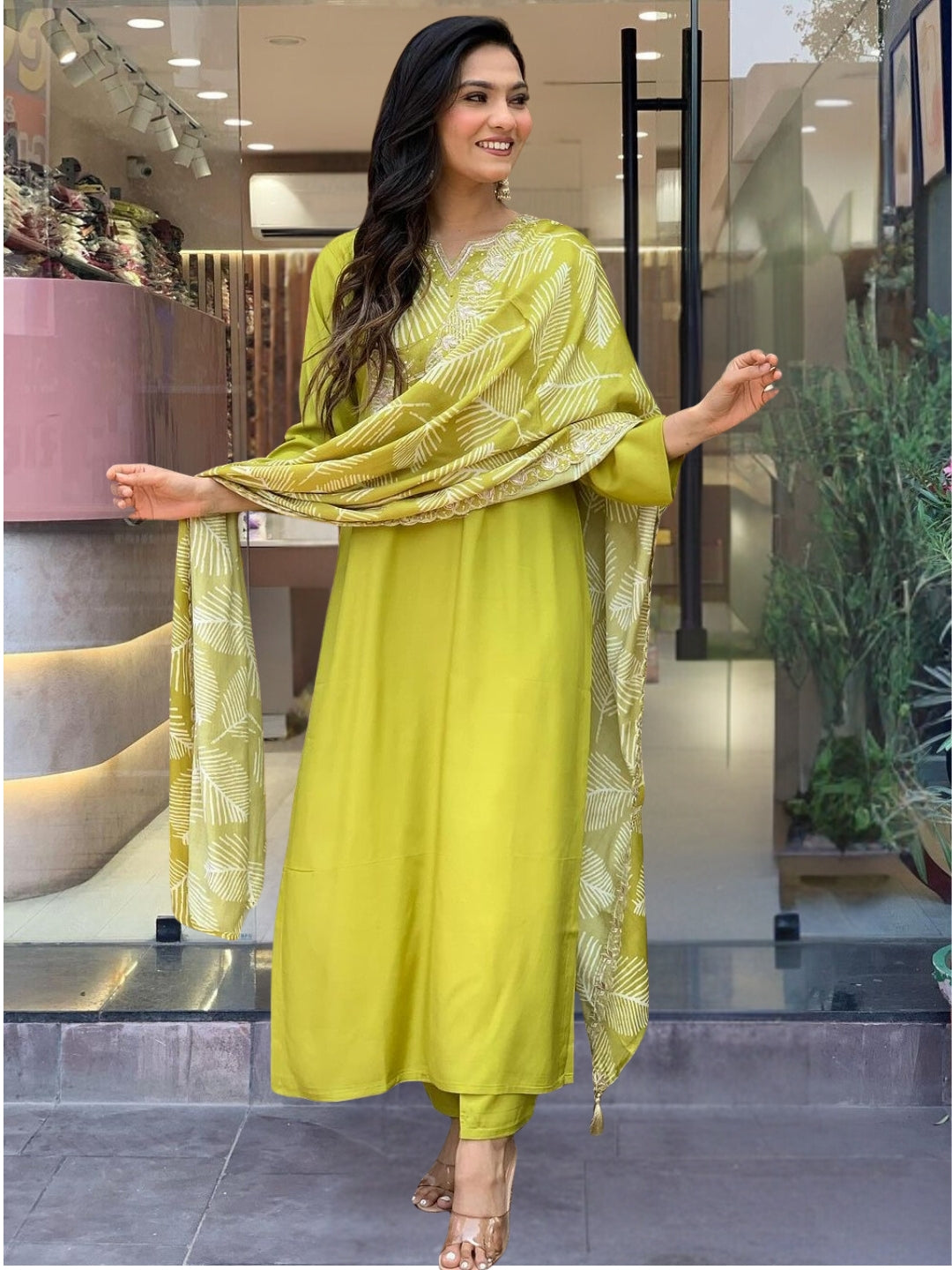 Embrace elegance with this refreshing green kurta set, featuring intricate embroidery and a graceful leaf-patterned dupatta