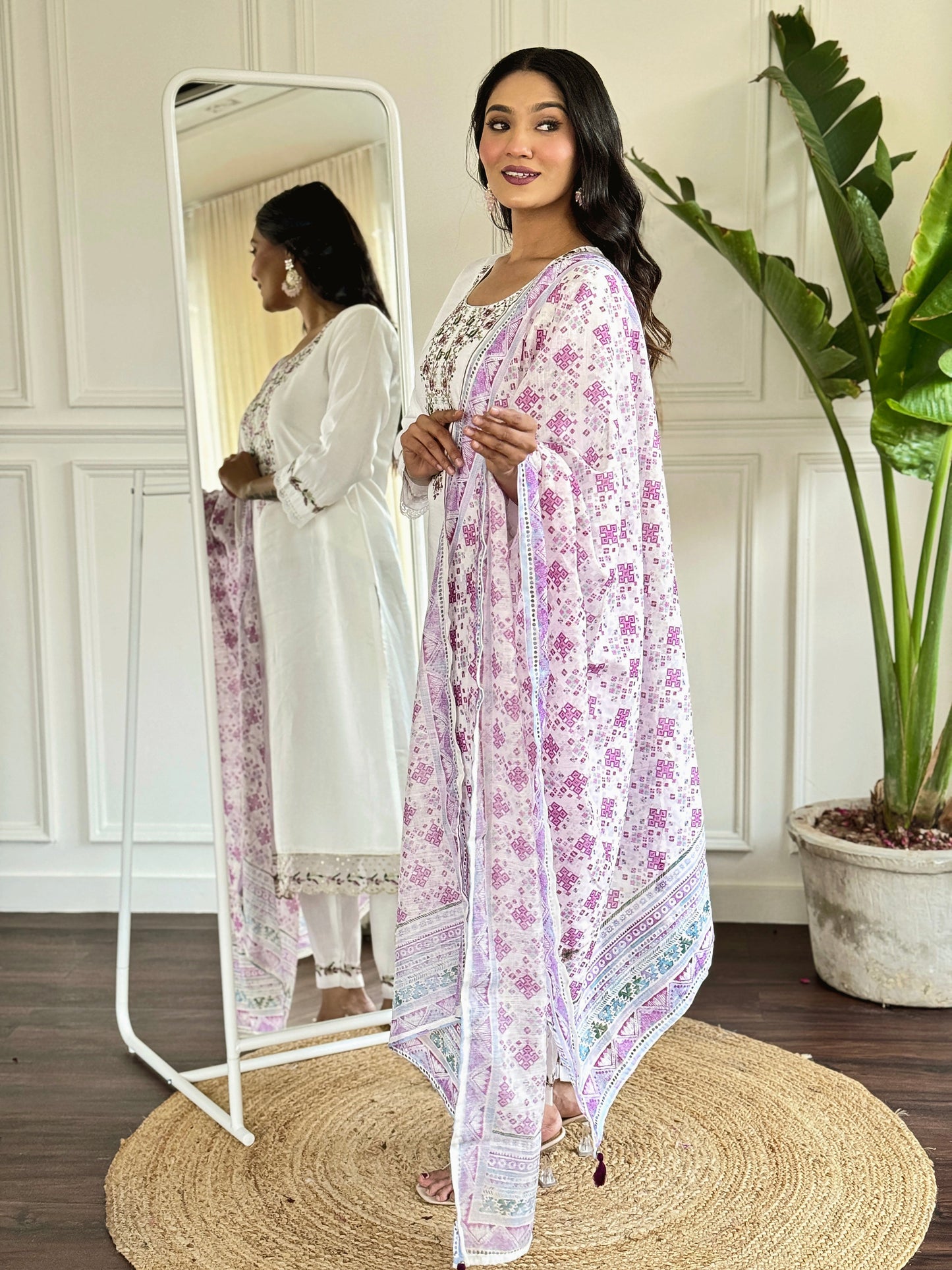 Embrace elegance with this white floral embroidered kurti set, paired with a charming printed dupatta