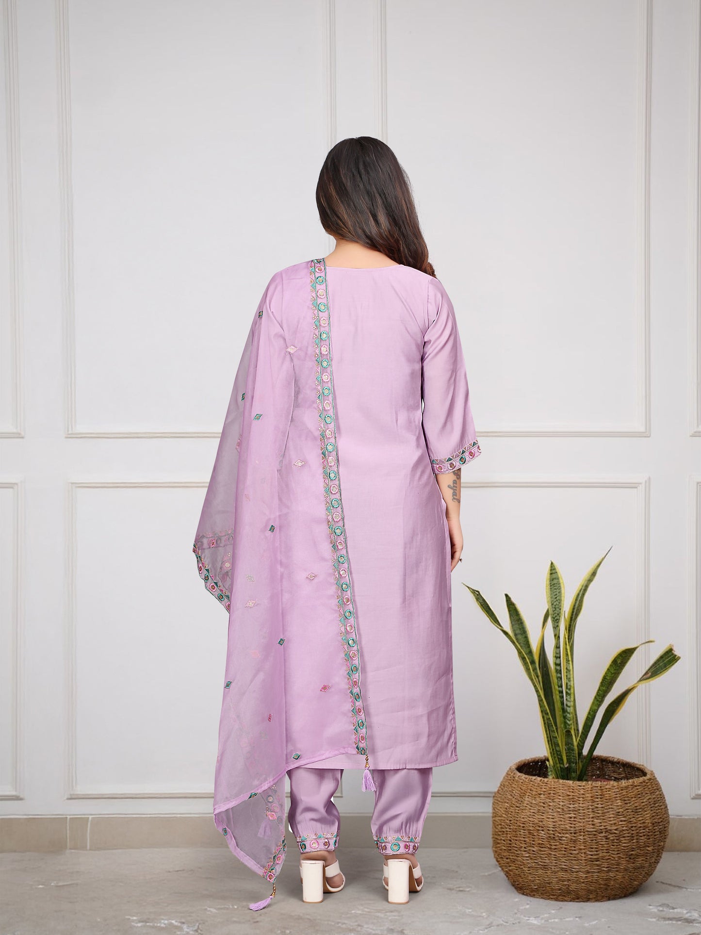 Grace meets elegance in this pastel lavender kurti set, adorned with delicate embroidery and mirror work