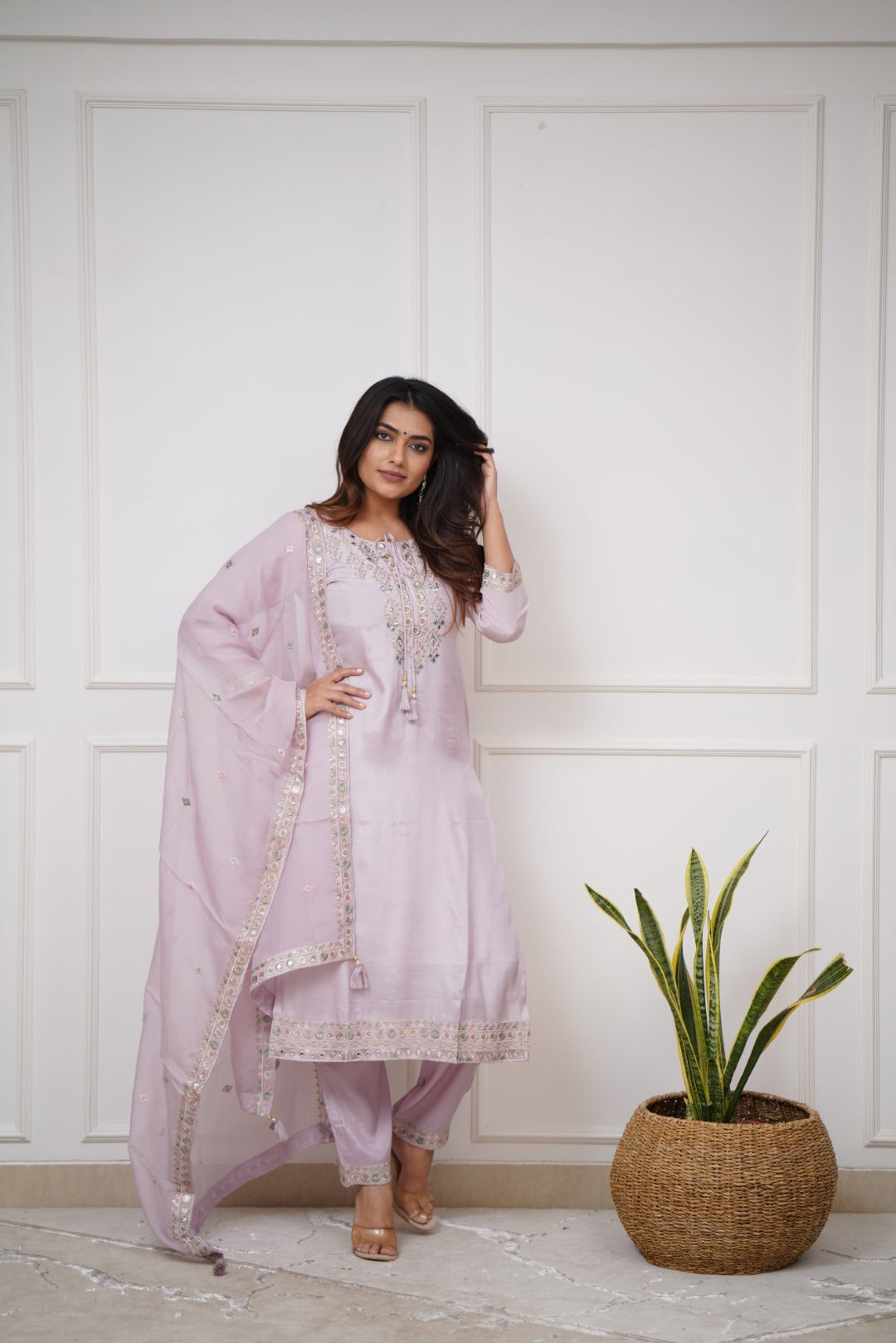 Grace meets elegance in this pastel lavender kurti set, adorned with delicate embroidery and mirror work